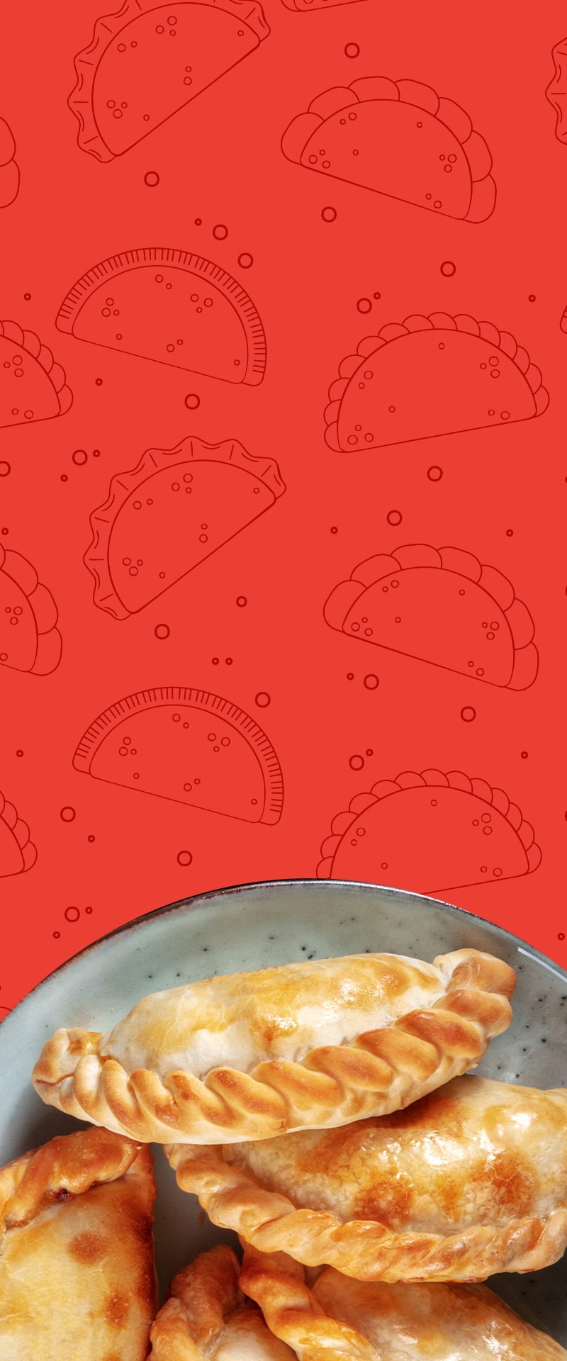 A plate of empanadas in front of a patterned background